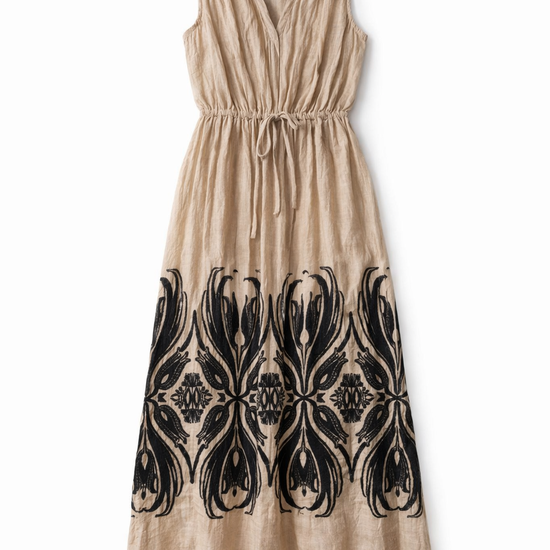 Beige dress with black pattern on a white background