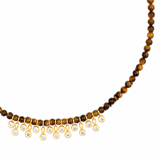 A beaded necklace featuring round brown and golden-brown tiger's eye beads with a fringe of gold-toned settings holding clear teardrop gemstones, shown against a plain white background.