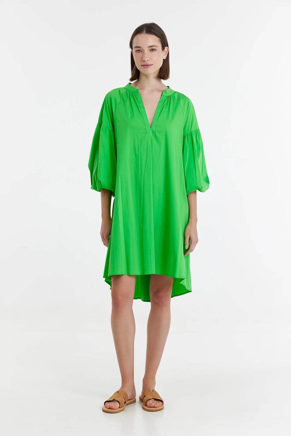 Green long sleeve dress with notch neck and full sleeves with elasticated cuffs