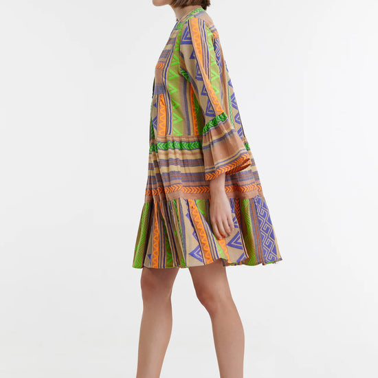 Biege notch neck beach dress with long fluted sleeves and tiered skirt with neon green orange and purple embroidery