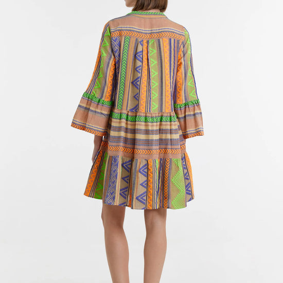 Biege notch neck beach dress with long fluted sleeves and tiered skirt with neon green orange and purple embroidery