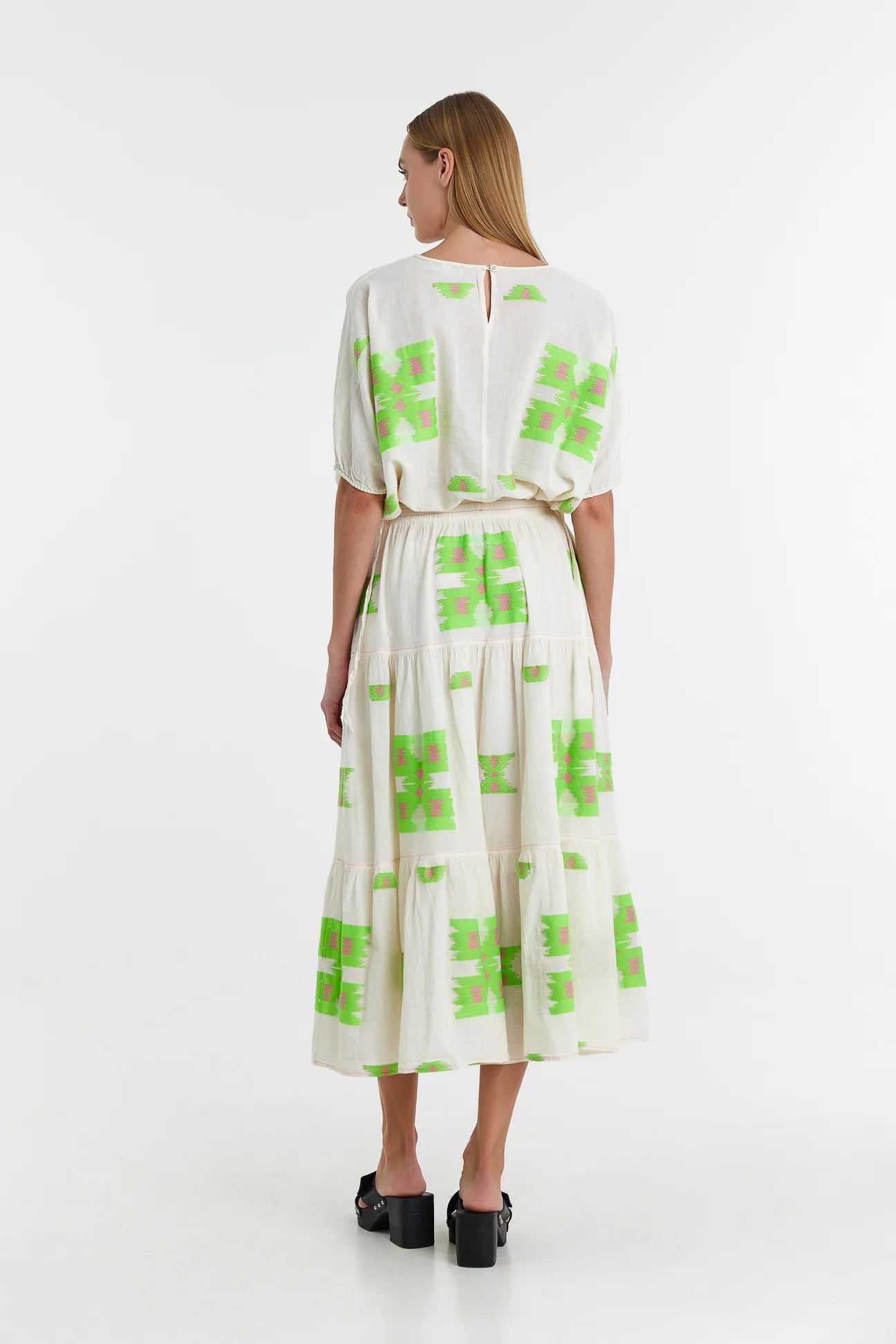 Midaxi skirt in ecru with lime green and pink abstract woven patterns throughout with a double tier and lining to the knee