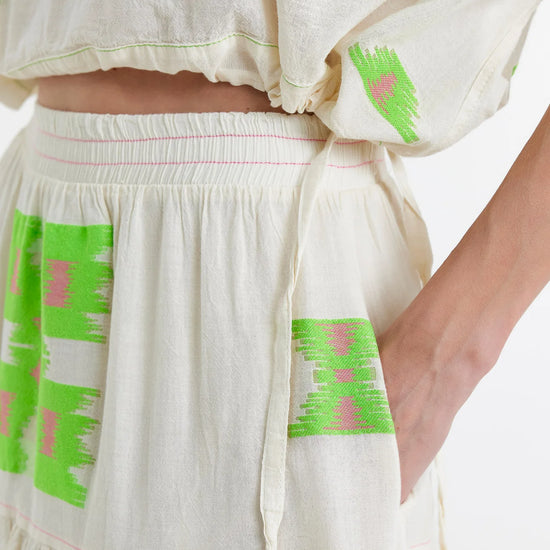 Midaxi skirt in ecru with lime green and pink abstract woven patterns throughout with a double tier and lining to the knee