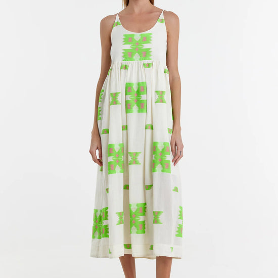 Ecru midi dress with empire line and spaghetti straps that cross at the back with green and pink abstract woven design throughout