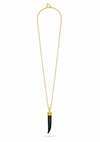 A gold chain necklace featuring a long, slender black pendant with a polished gold cap, displayed against a solid white background.