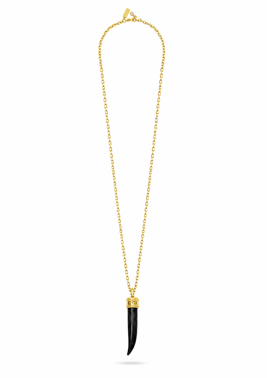 A gold chain necklace featuring a long, slender black pendant with a polished gold cap, displayed against a solid white background.