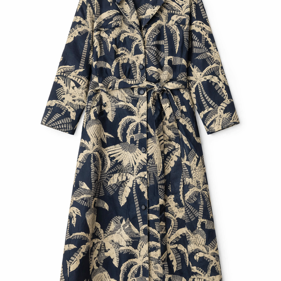 Navy dress with palm tree pattern on a white background