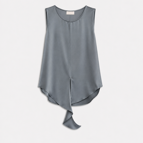 A sleeveless, high-low draped top in a muted slate gray color, displayed flat against a light gray background.