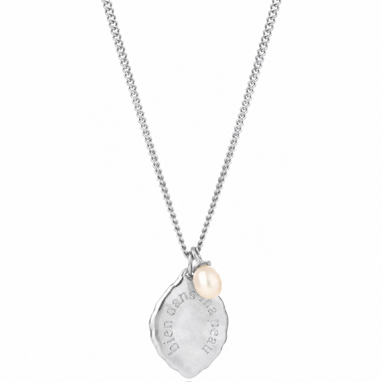 Silver necklace with a teardrop-shaped pendant on a white background