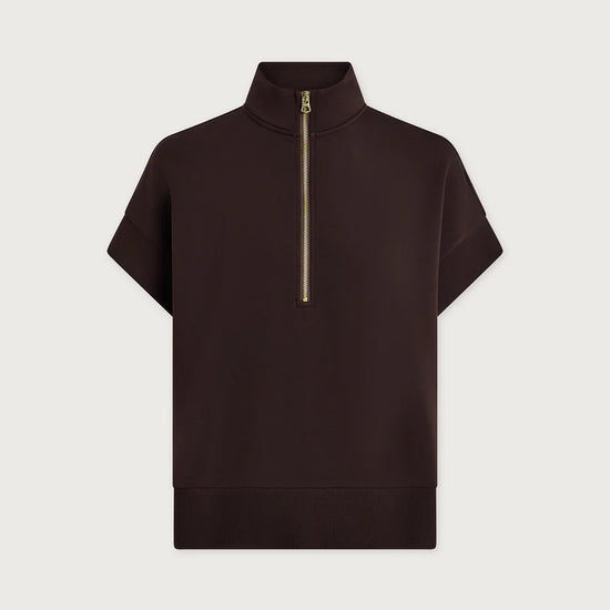 Black short-sleeve top with a gold zipper on a light gray background