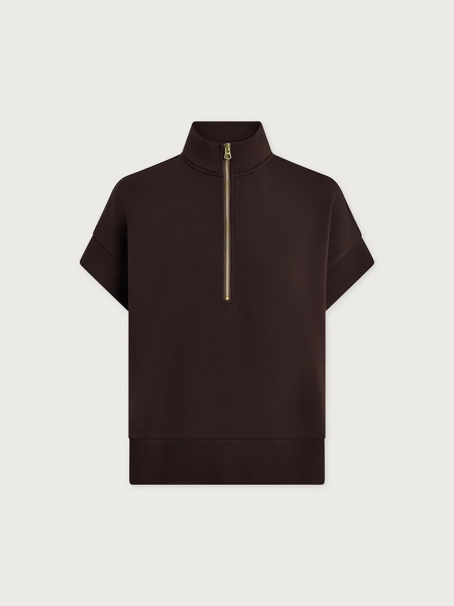 Black short-sleeve top with a gold zipper on a light gray background