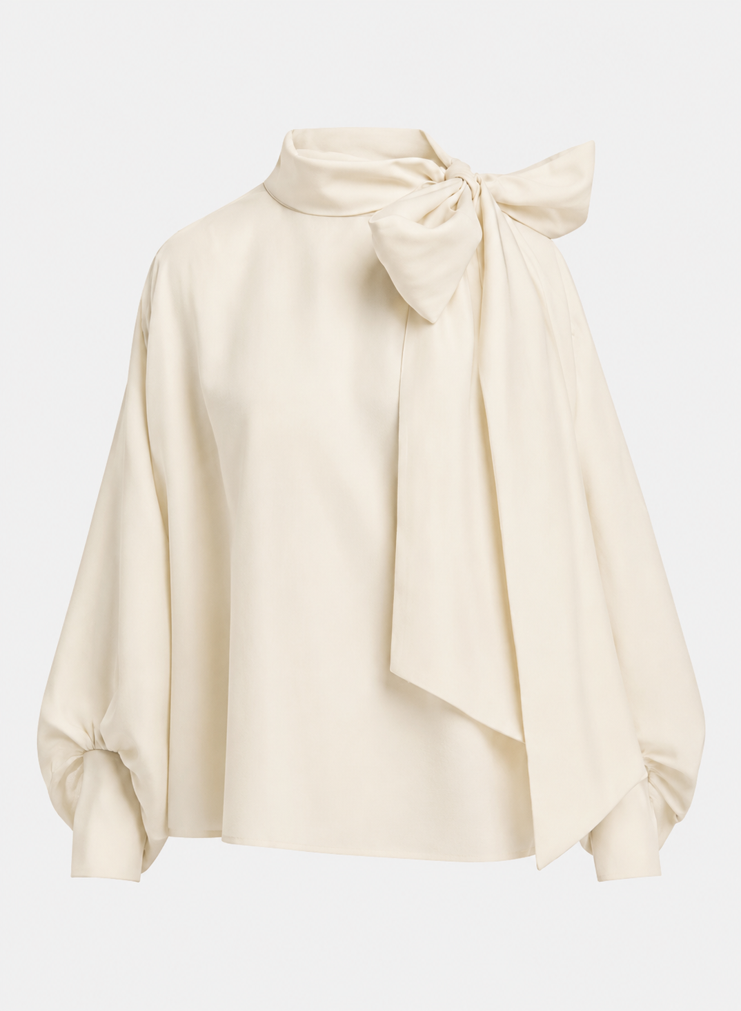 An off-white satin blouse with a high neck, large bow at the collar, and balloon sleeves, shown on a light gray background.