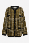 A plaid cardigan sweater featuring an olive green, beige, and black checkered pattern with black trim and button details, shown flat on a light gray background.