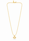 A gold chain necklace with a small oval pendant featuring a clear central stone, displayed against a plain white background.
