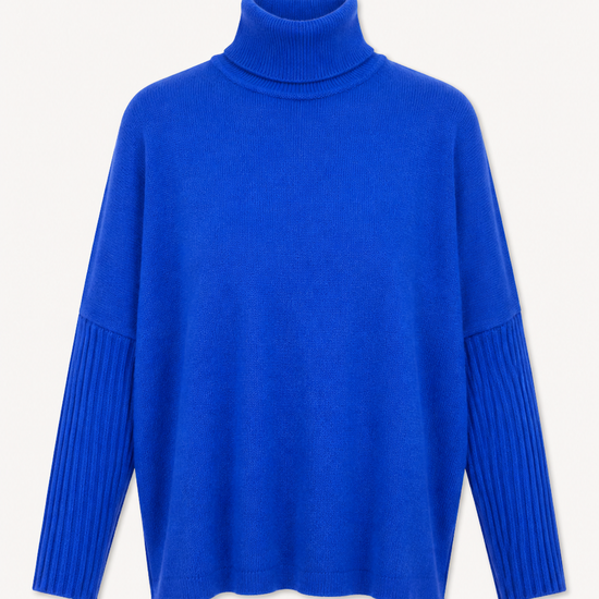 flat lay image of a bright blue roll neck on a white background 