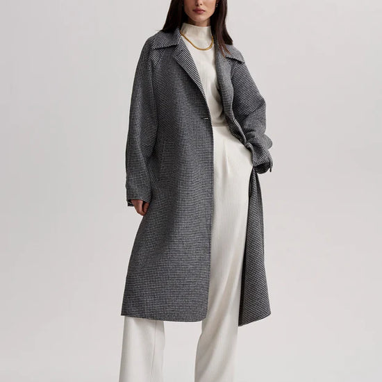 black houndstooth coat with tie belt