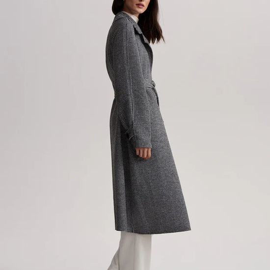 black houndstooth coat with tie belt side view 