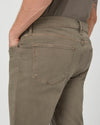 mushroom brown slim straight jeans with black button close up of rear view 