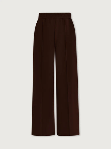 Brown wide-leg pants on a light beige background