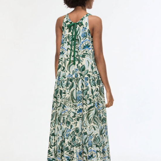 woman from the back wearing floral green dress 