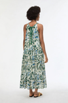 woman from the back wearing floral green dress 
