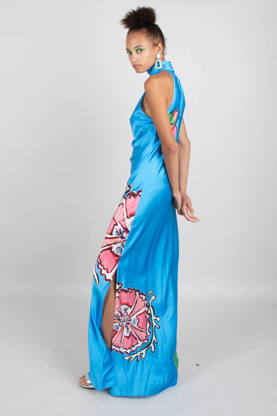 Sky blue halterneck silk dress with bold pink and white floral placement print design