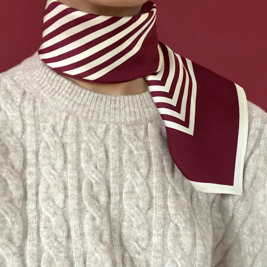 Silk scarf from lescarf tied at the neck 