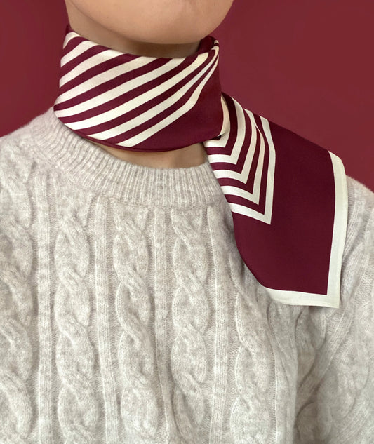 Silk scarf from lescarf tied at the neck 