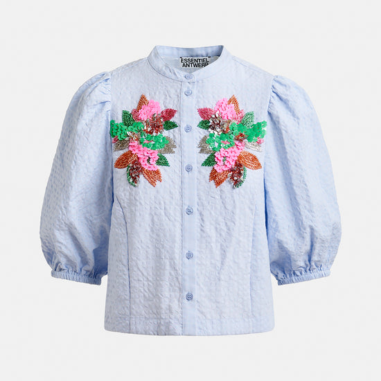 Blue embroided shirt by Essentiel Antwerp on a white background