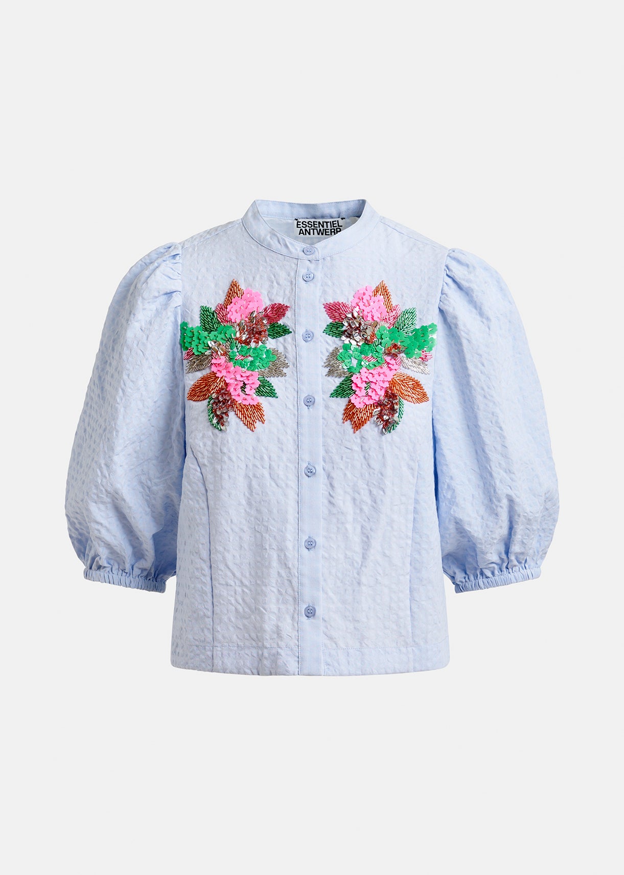Blue embroided shirt by Essentiel Antwerp on a white background