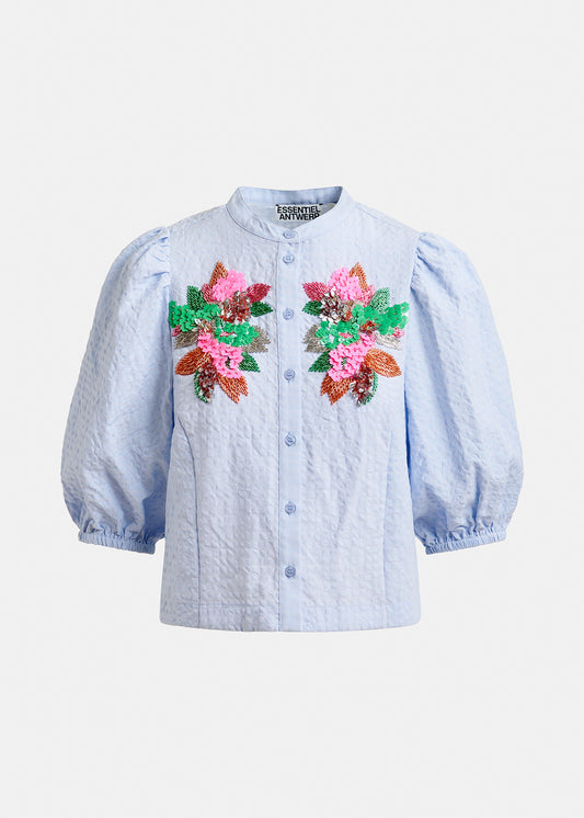Blue embroided shirt by Essentiel Antwerp on a white background