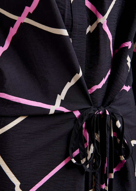 Black dress with pink and beige geometric pattern by Essentiel Antwer close up 