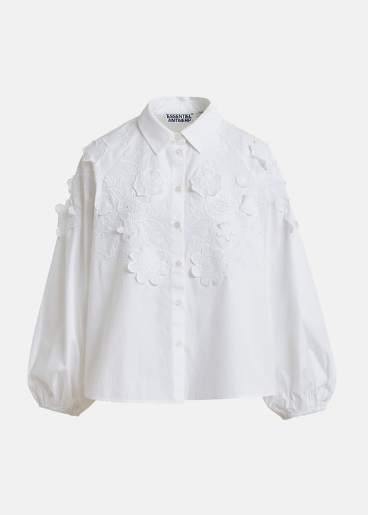 White blouse with floral applique details by Essentiel Antwerp on a white background