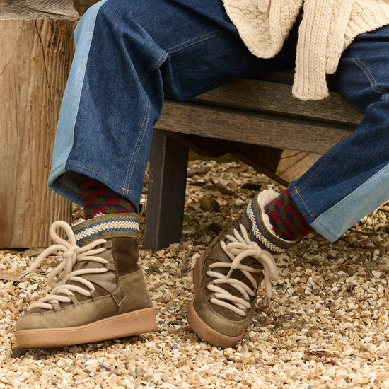 khaki green leather and suede boots worn with denim