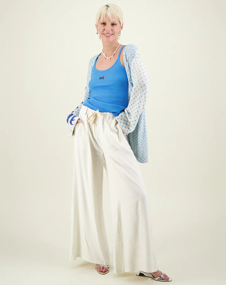 Cream linen wide leg trousers with elasticated waistband and drawstring waist with inseam side pockets