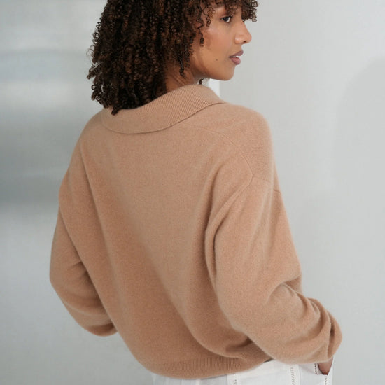 Woman wearing a camel sweater and white pants against a plain background from Lilly Pilly