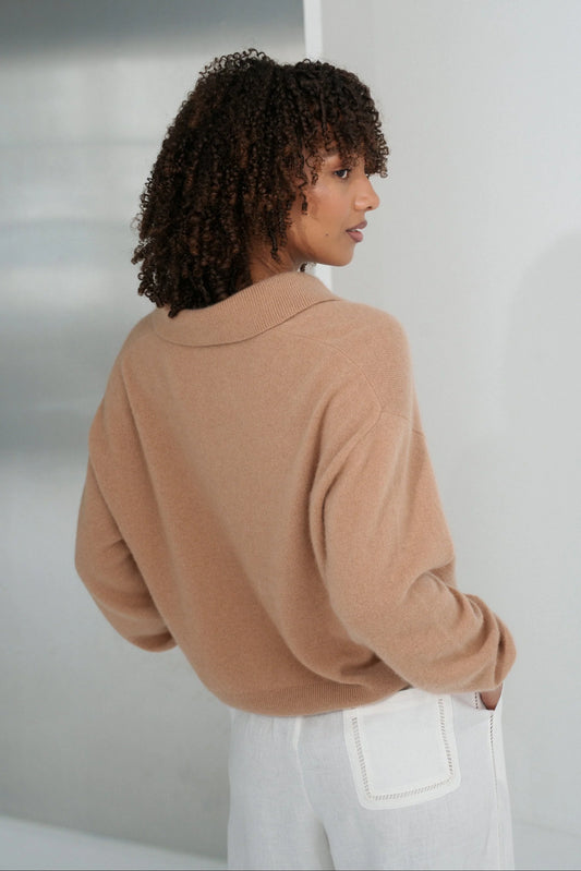 Woman wearing a camel sweater and white pants against a plain background from Lilly Pilly