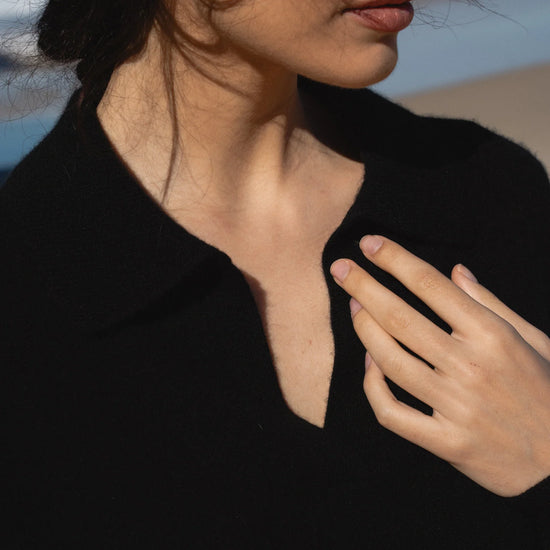 Woman wearing a black shirt with a blurred background