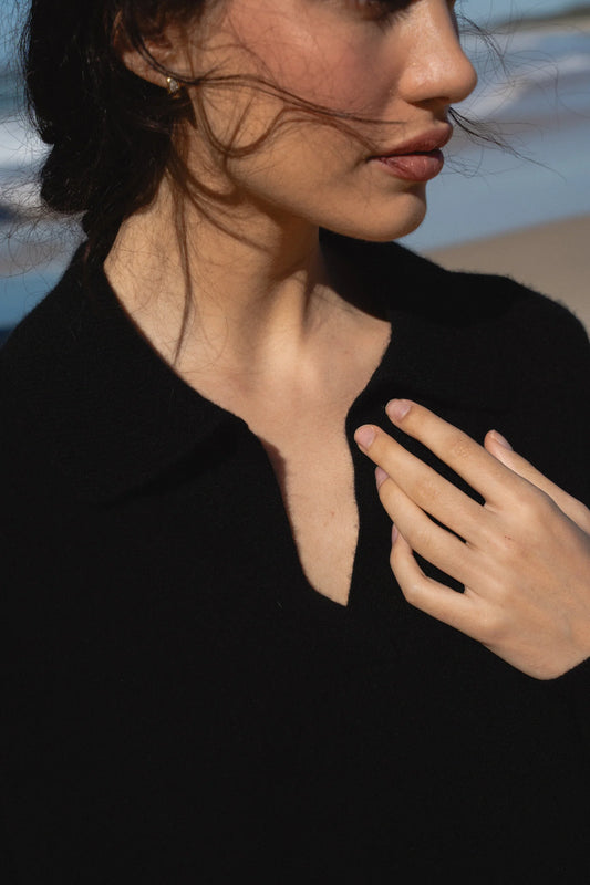 Woman wearing a black shirt with a blurred background