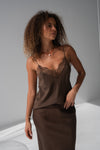 Woman wearing brown cami and skirt set close up