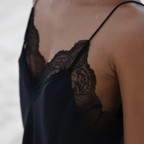 detail of lace and silk on camisole top