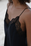 detail of lace and silk on camisole top