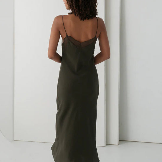 khaki silk mid length slip dress with spaghetti straps and lace detailing rear view