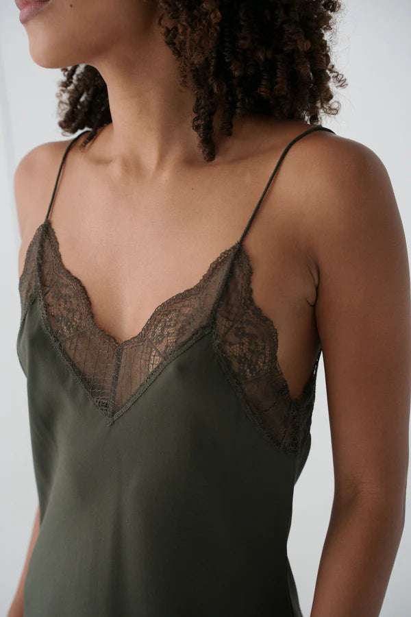 khaki silk mid length slip dress with spaghetti straps and lace detailing close up