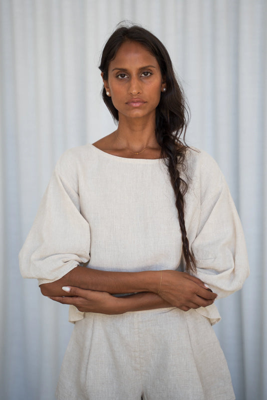 Woman wearing a white outfit against a light background from Lilly Pilly