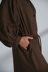 Brown dress with a plain background