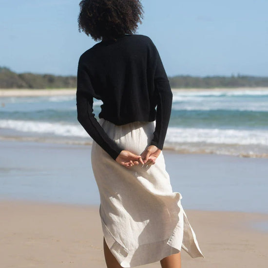 black cashmere jumper with round neck and ribbed sleeves  rear view 