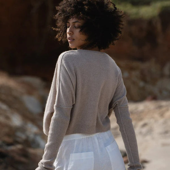 oatmeal cashmere jumper with round neck and ribbed sleeves  rear view 