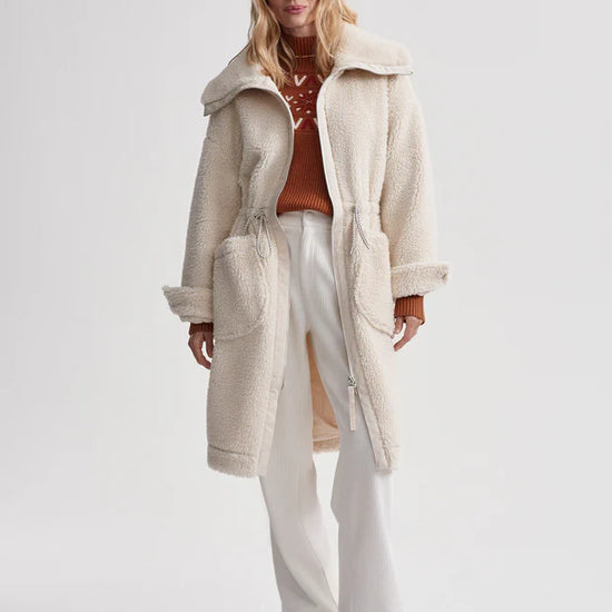 cream sherpa coat with high neck, 2 large patch pockets and drawstring waist model shot