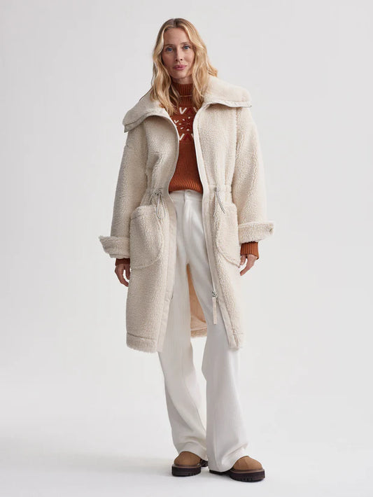 cream sherpa coat with high neck, 2 large patch pockets and drawstring waist model shot